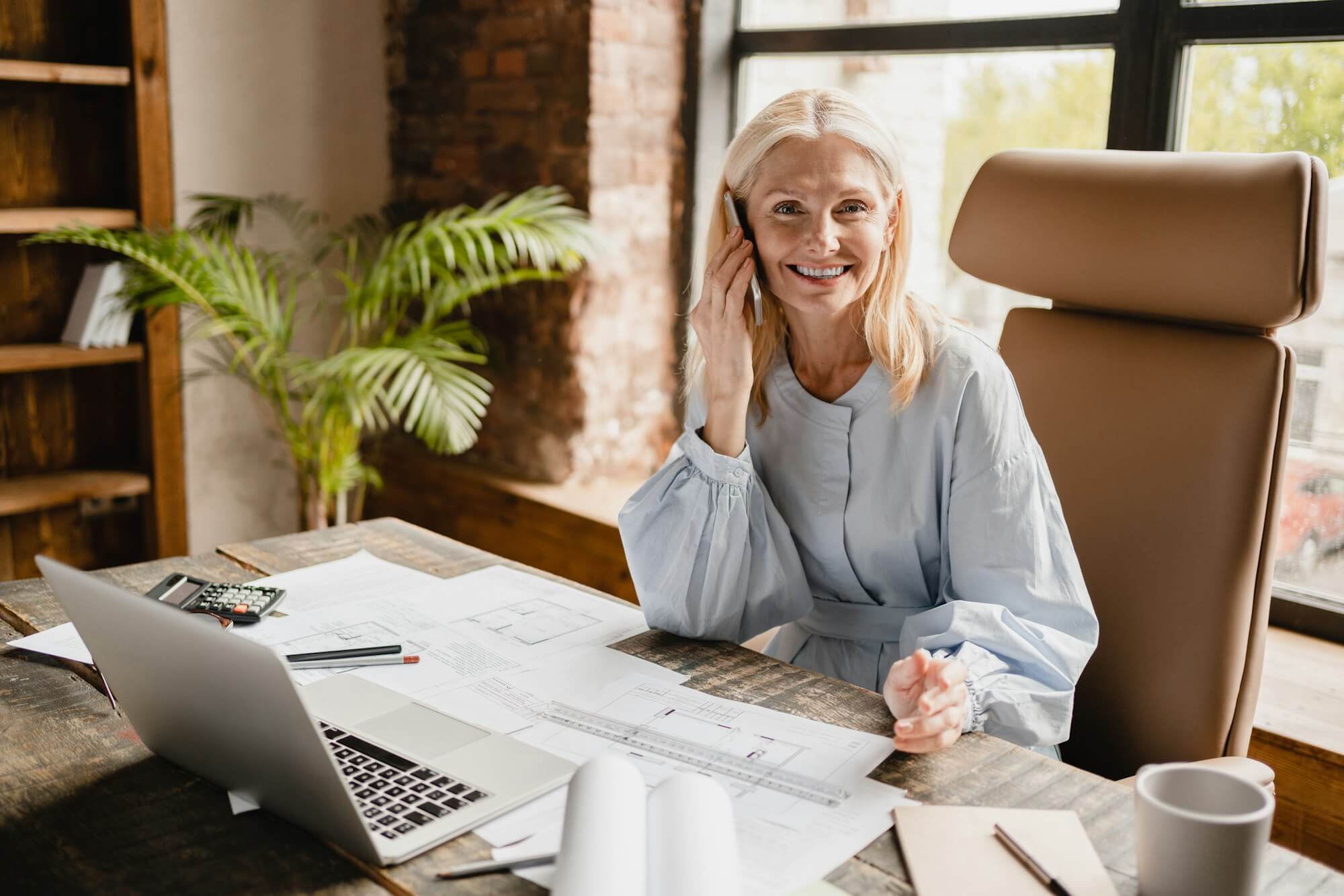 engineer talking on smartphone with clients boss working on architectural plans drawing projects Residential Garage Door Repair & Service 18 engineer talking on smartphone with clients boss working on architectural plans drawing projects Residential Garage Door Repair & Service 17